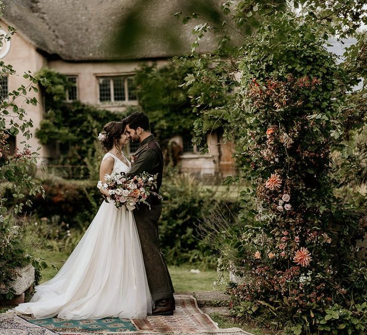 Floral pillars for outdoor September wedding ceremony