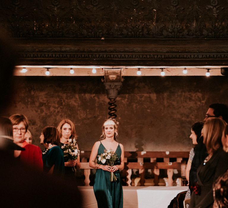 Bridesmaid Walking Down the Aisle in Forest Green Dress