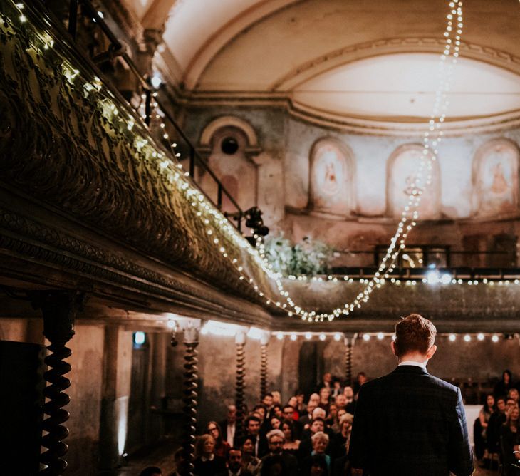 Wedding Ceremony with Groom Waiting on Stage at Wilton's Music Hall for His Bride to Arrive