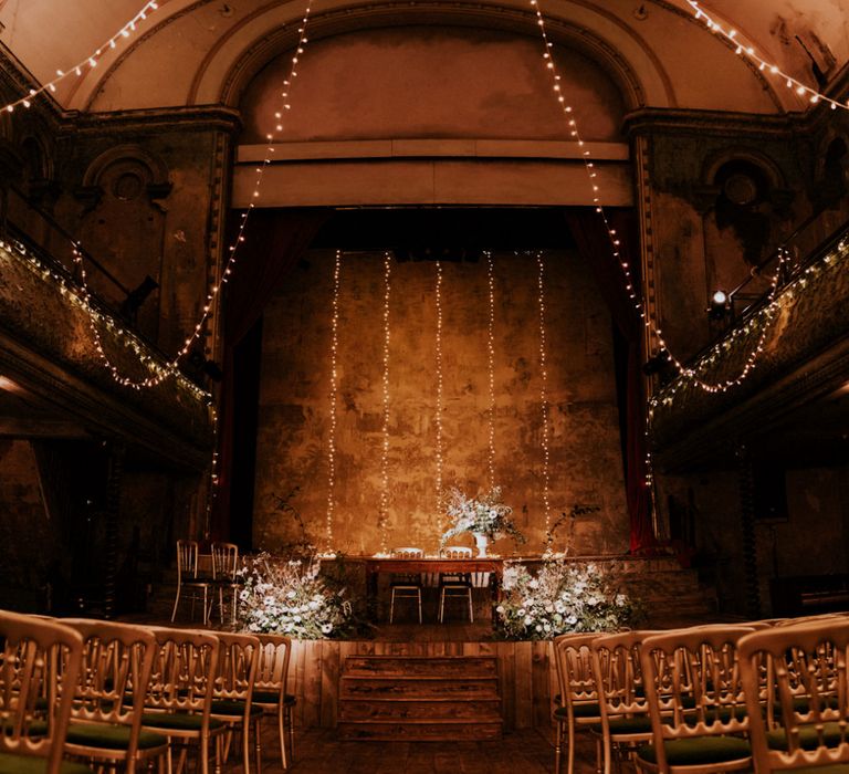 Wedding Ceremony at Wilton's Music Hall with Hanging Fairy Lights