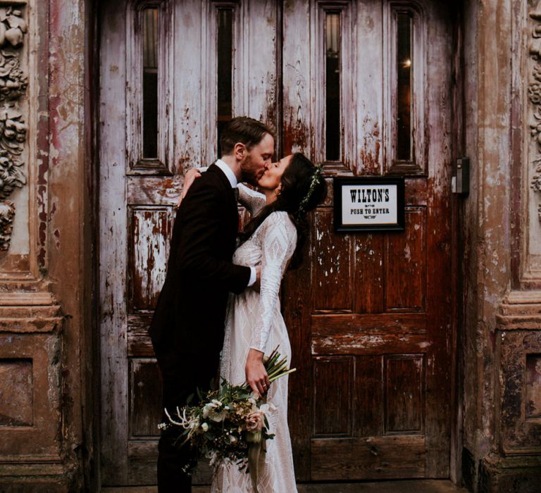 Urban Portrait of Bride in Grace Loves Lace Wedding Dress and Groom in Dark Suit Outside Wilton's Music Hall