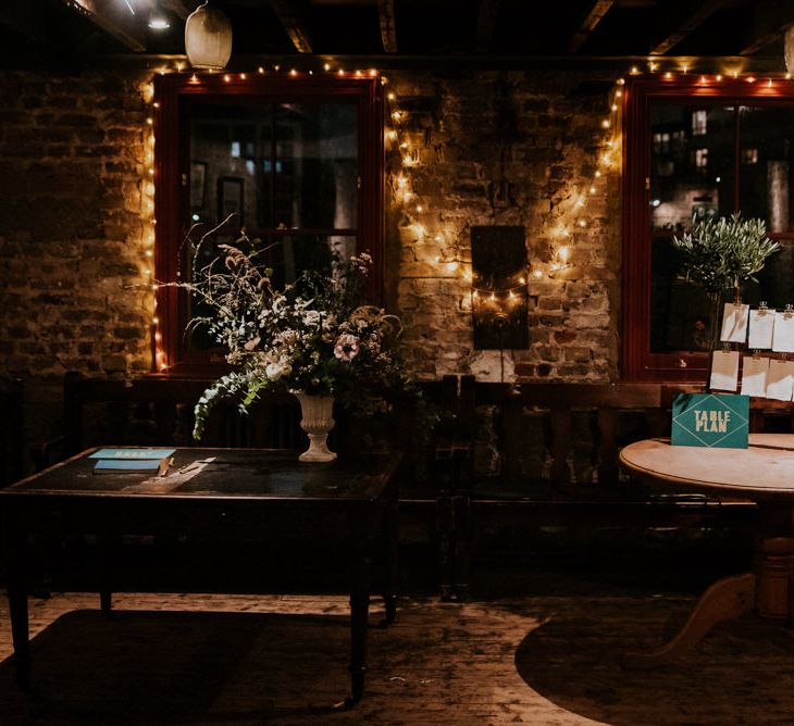 Table Plan and Wedding Guest Book Stations Decorated with Fairy Lights