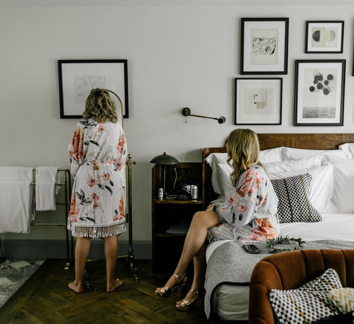 Wedding morning bridal preparation with bride in floral getting ready robe