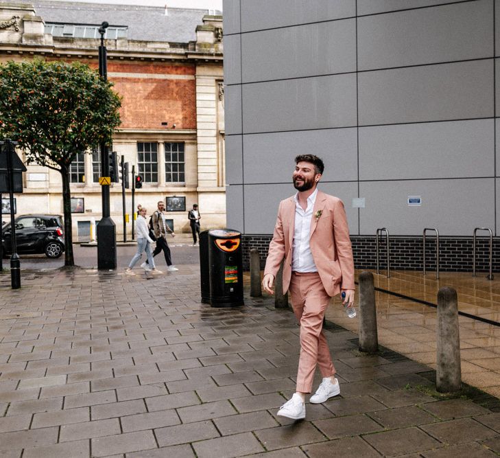 Groom in pink suit at Hackney Town Hall micro wedding