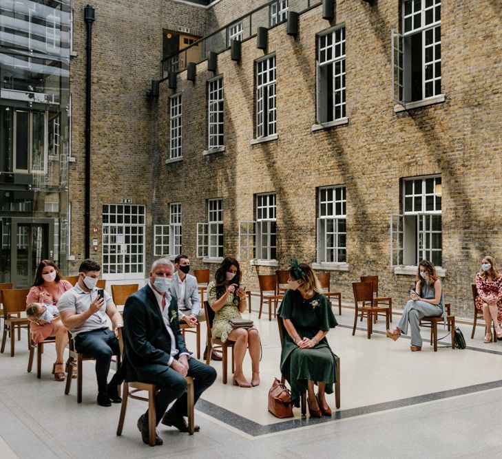 Intimate wedding ceremony at Hackney Town Hall under the roofed atria