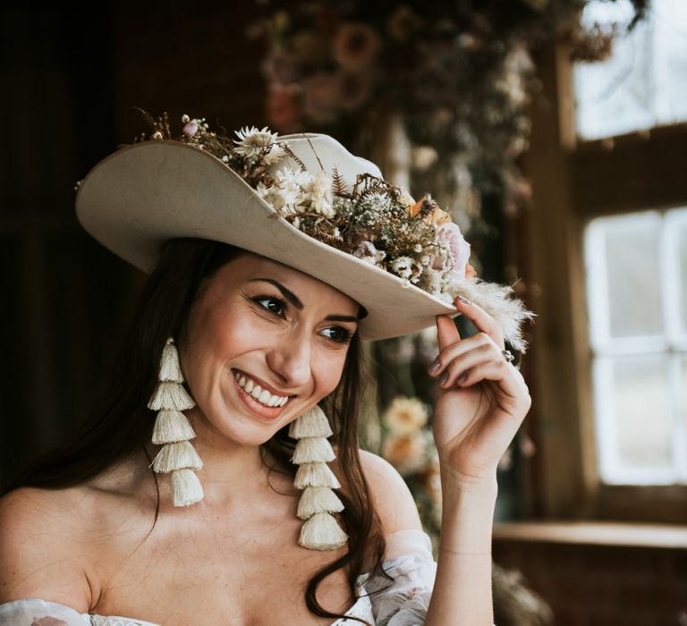 Bride Wearing Tassel Earrings and Cowboy Hat