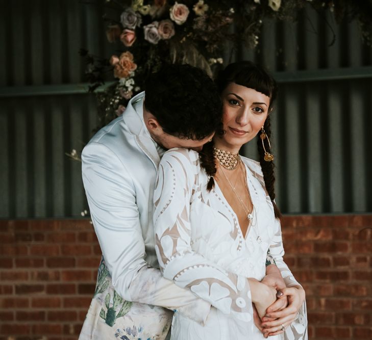 Bohemian Bride and Groom Embracing