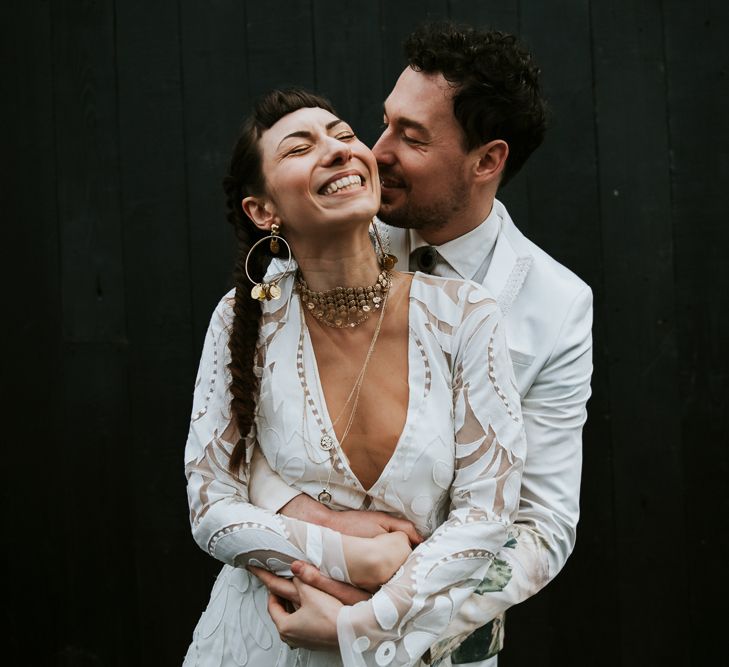 Boho Bride and Groom Embracing