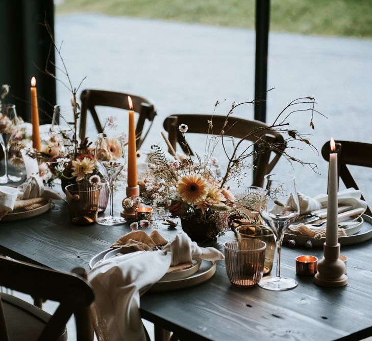 Coloured Candles, Floral Centrepieces and Beautiful Place Settings