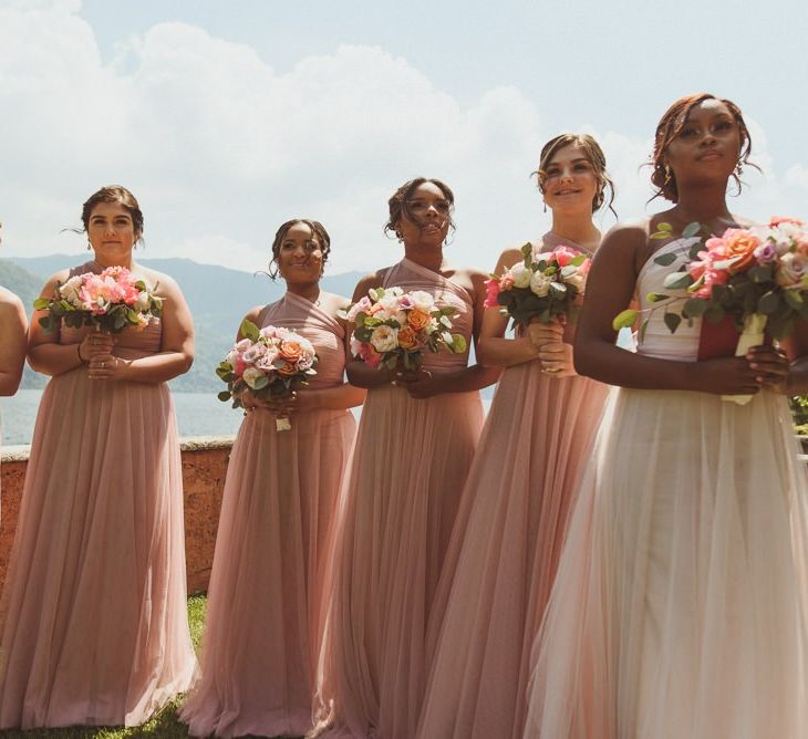 Bridal party in pink and white chiffon dresses