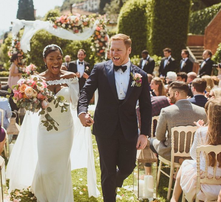 Bride and Groom walk up the aisle as husband and wife