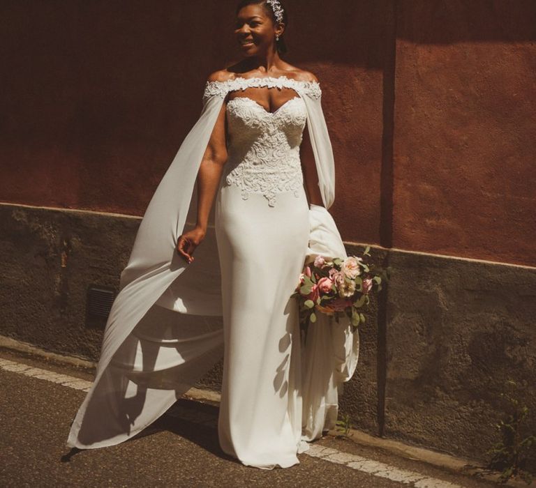 Bride in Justin Alexander bridal cape for Lake Como wedding