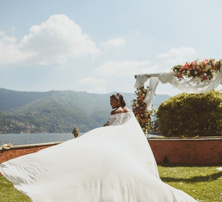 Bride twirling her wedding cape