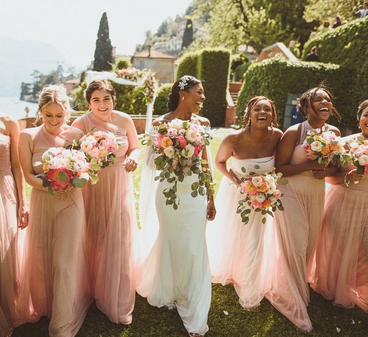 Bridal party portrait with bridesmaids in pink chiffon dresses