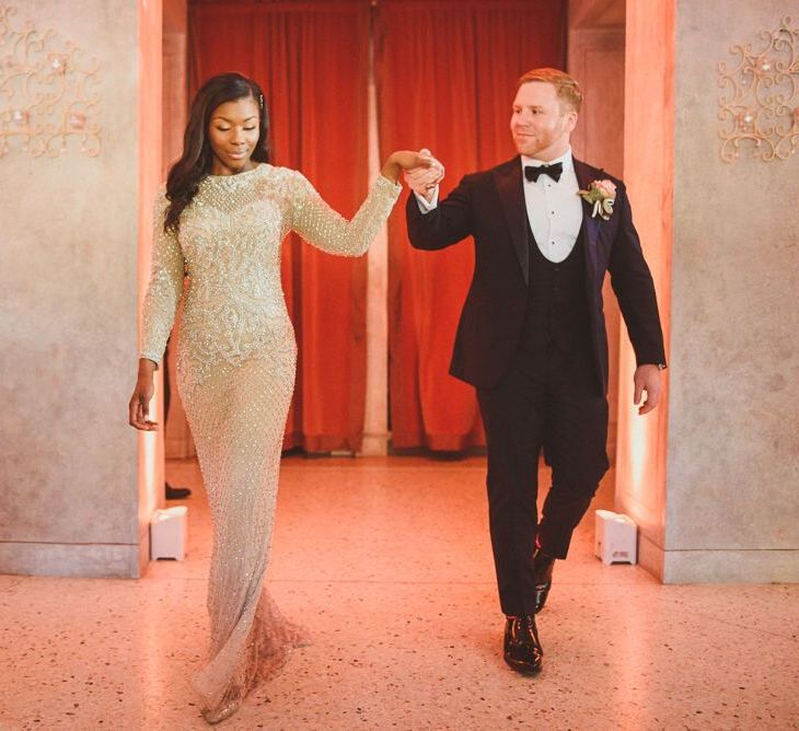 Bride in gold evening dress with with Groom in tuxedo