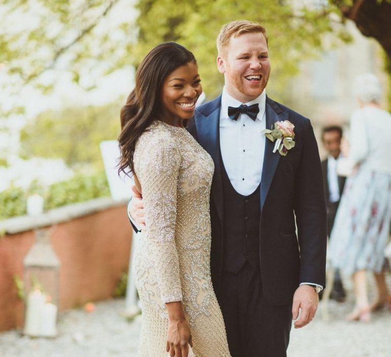 Bride in embellished gold evening wedding dress