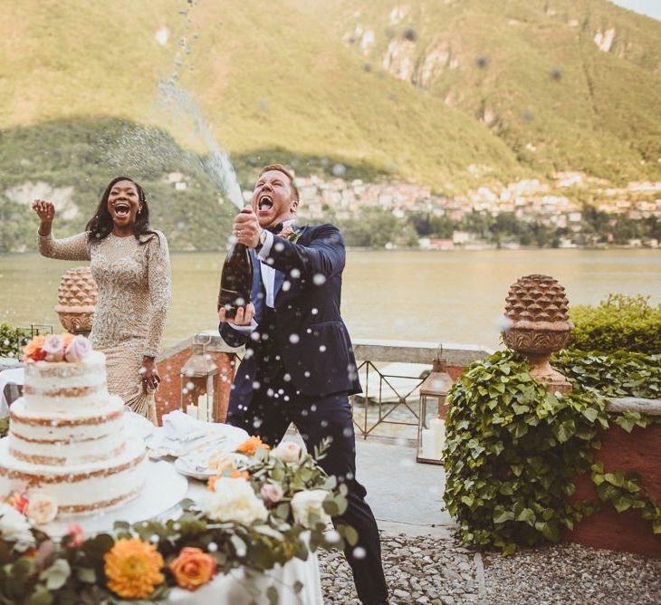 Groom spraying champagne