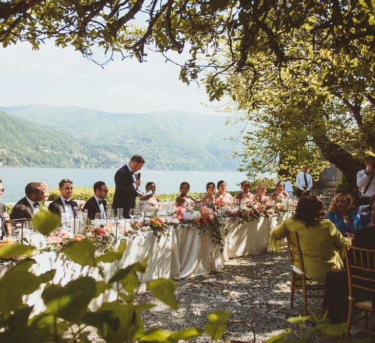 Groom delivering his speech at the top table with views of Lake Como