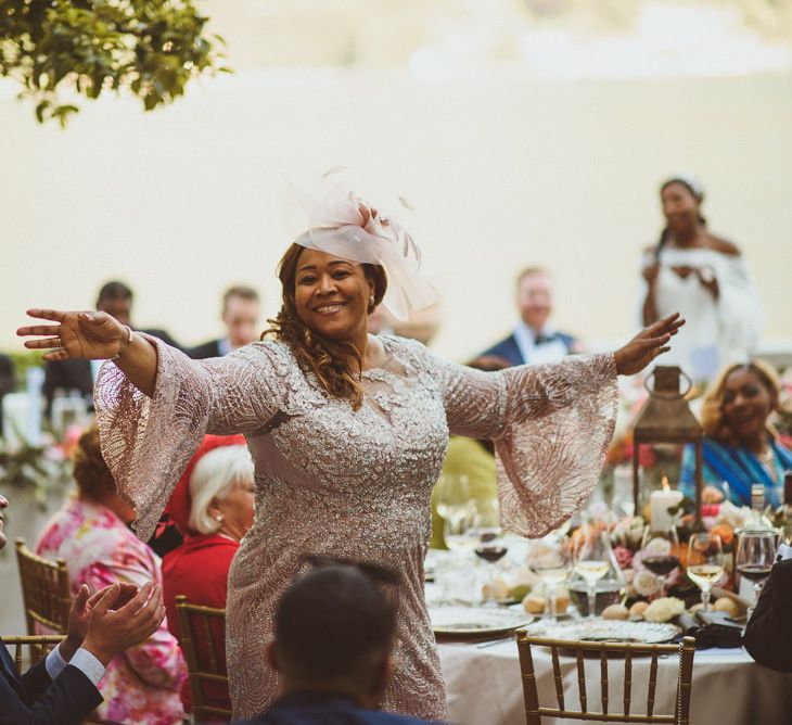 Beautiful Mother of the Bride in blush bell sleeve  dress