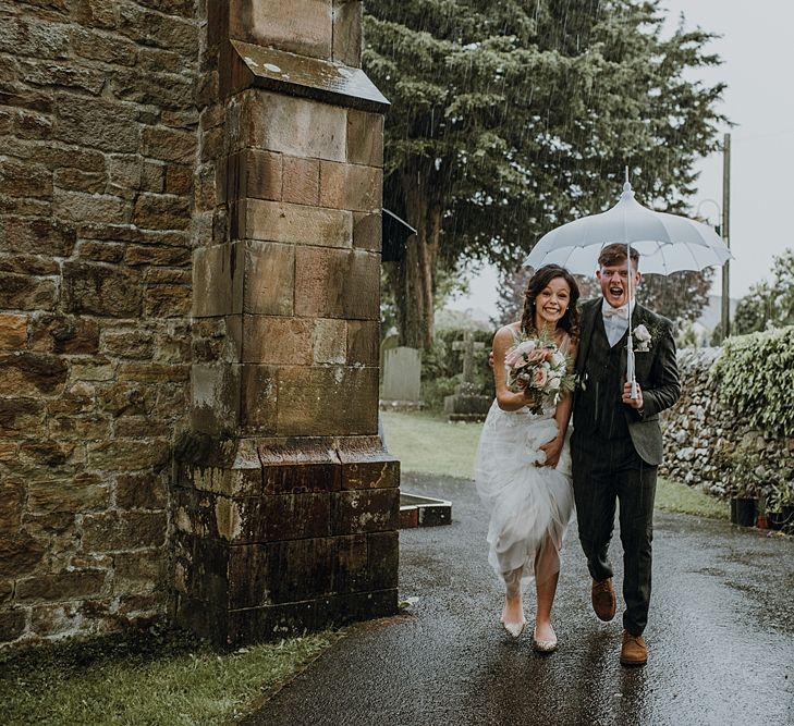 Florals by Mother of the Bride at Abundance Flowers and The Real Flower Company . Tipi Wedding at Home, Cumbria. Pale Dusky Pink, White and Mocha Flowers, Handwritten Details and Festoon Lights. Bride wears Essence of Australia Dress from Angelica Bridal. Groom wears Olive Next Suit and Tan Office Shoes.