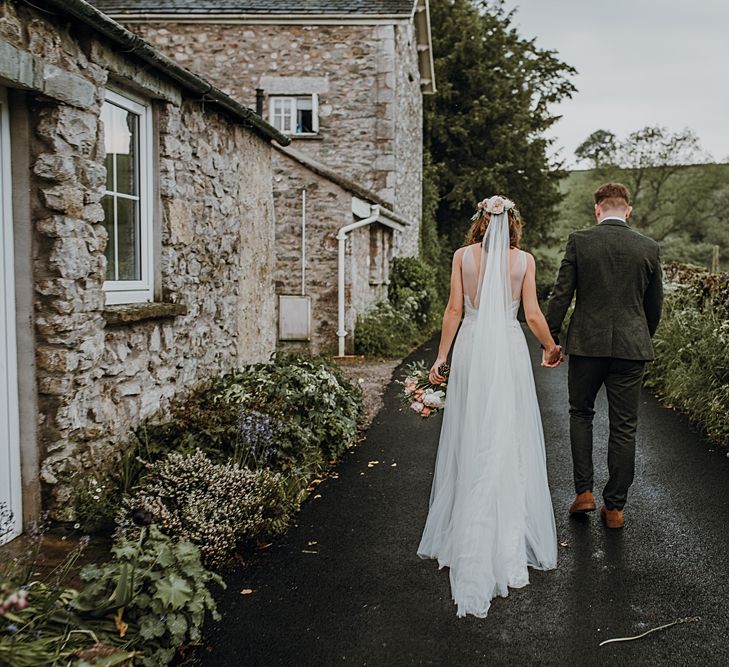 Tipi Wedding at Home, Cumbria. Pale Dusky Pink, White and Mocha Flowers, Handwritten Details and Festoon Lights. Bride wears Essence of Australia Dress from Angelica Bridal. Groom wears Olive Next Suit and Tan Office Shoes.