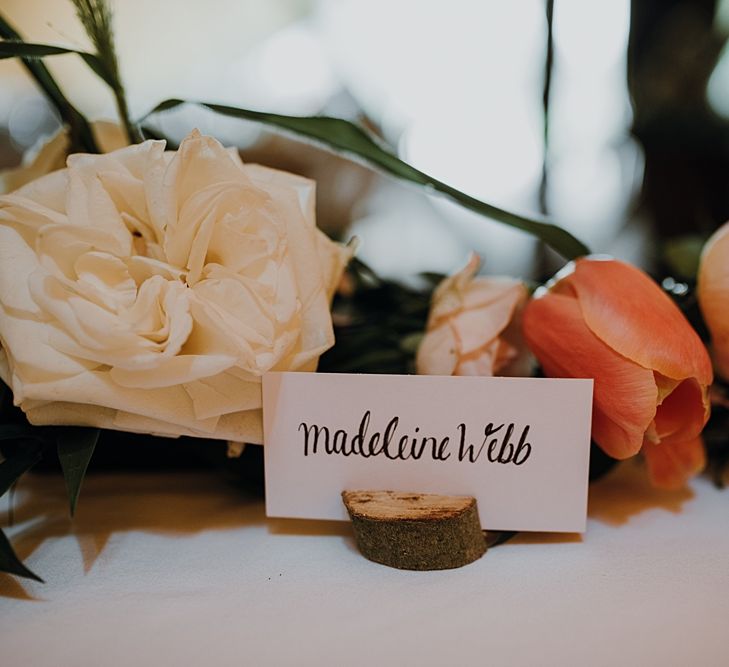 Florals by Mother of the Bride at Abundance Flowers and The Real Flower Company. Hand-painted Signage. Tipi Wedding at Home, Cumbria. Pale Dusky Pink, White and Mocha Flowers, Handwritten Details and Festoon Lights. Bride wears Essence of Australia Dress from Angelica Bridal. Groom wears Olive Next Suit and Tan Office Shoes.