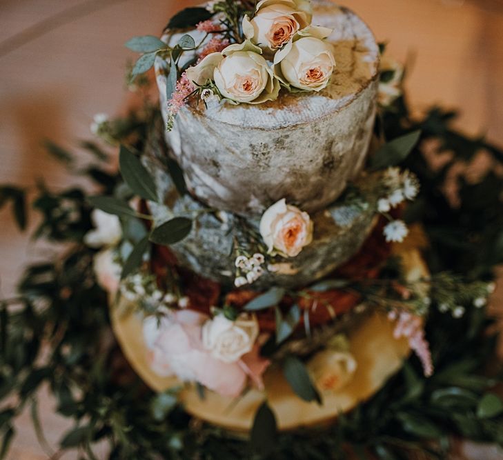 Cheese Cake from the Cheese Larder. Tipi Wedding at Home, Cumbria. Pale Dusky Pink, White and Mocha Flowers, Handwritten Details and Festoon Lights. Bride wears Essence of Australia Dress from Angelica Bridal. Groom wears Olive Next Suit and Tan Office Shoes.