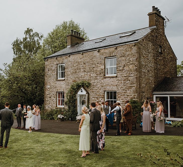 Tipi Wedding at Home, Cumbria. Pale Dusky Pink, White and Mocha Flowers, Handwritten Details and Festoon Lights. Bride wears Essence of Australia Dress from Angelica Bridal. Groom wears Olive Next Suit and Tan Office Shoes.