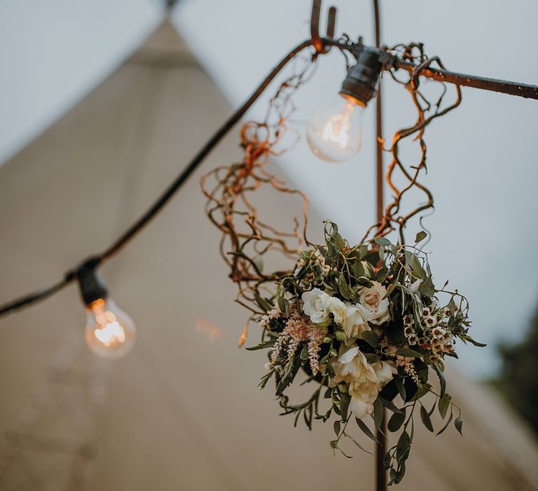 Tipi Wedding at Home, Cumbria. Pale Dusky Pink, White and Mocha Flowers, Handwritten Details and Festoon Lights. Bride wears Essence of Australia Dress from Angelica Bridal. Groom wears Olive Next Suit and Tan Office Shoes.