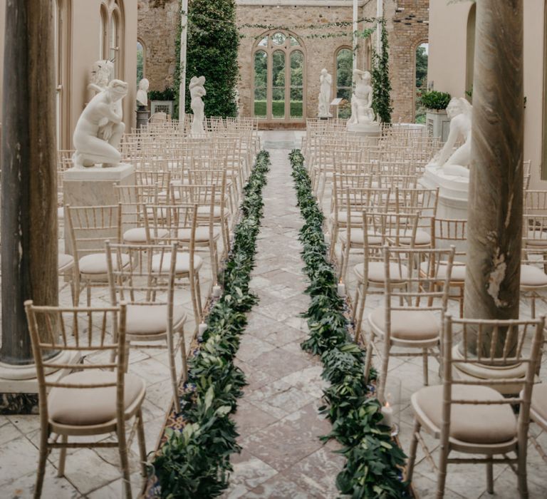 Orangery Ceremony Room  at Killruddery House and Gardens Wedding Venue in Ireland with Greenery Aisle Runway  Decor