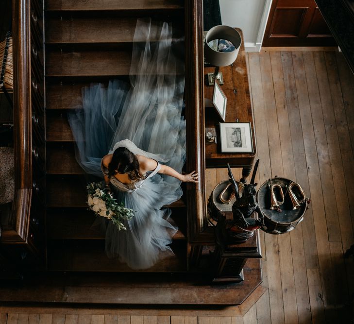 Bride in Tulle Custom Made Blue Claire La Faye Wedding Dress Walking Down The Stairs