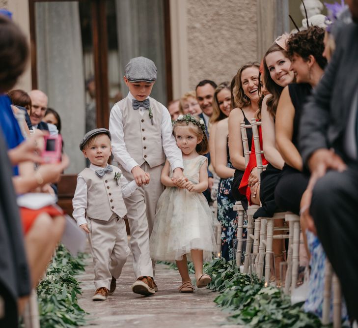 Page Boys and Flower Girl Walking Down The Aisle