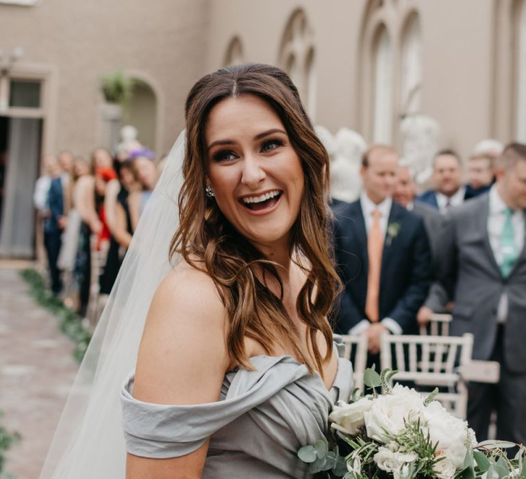 Laughing Bride with Wavy Half Up Half Down Hair