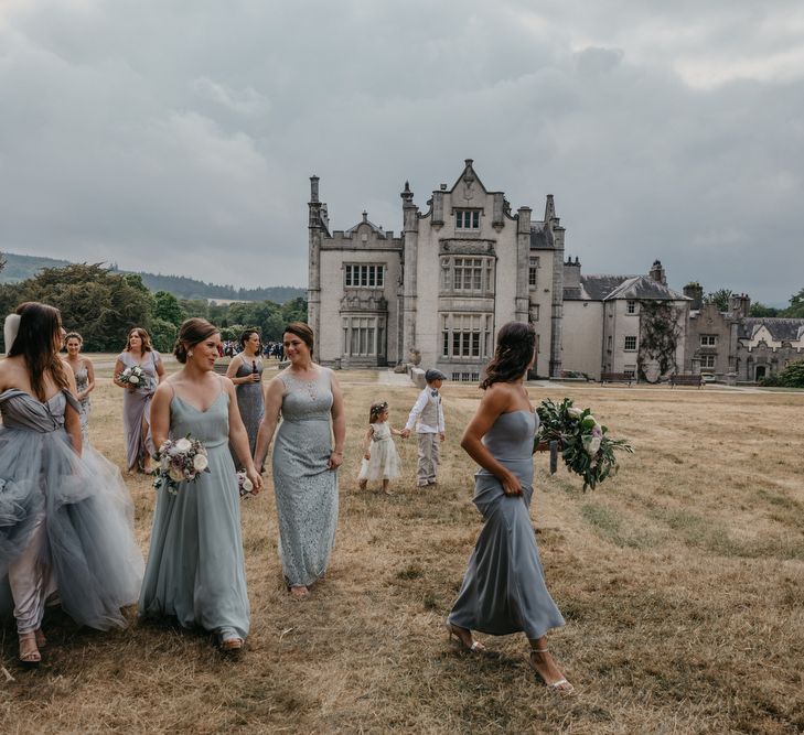 Bridal Party with Bride in Custom Made Blue Claire La Faye Wedding Dress and Bridesmaids in Different Grey Dresses