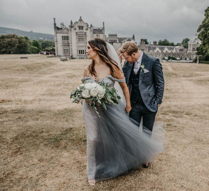 Bride in Custom Made Blue Claire La Faye Wedding Dress and Groom in Bespoke Alton Lane Wool Suit