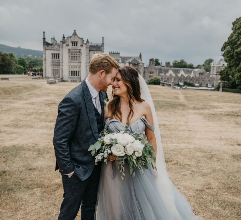 Bride in Custom Made Claire La Faye Wedding Dress and Groom in Bespoke Alton Lane Suit