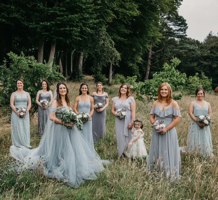 Bridal Party Portrait with Bride in Custom Made Blue Claire La Faye Wedding Dress and Bridesmaids in Different Dresses