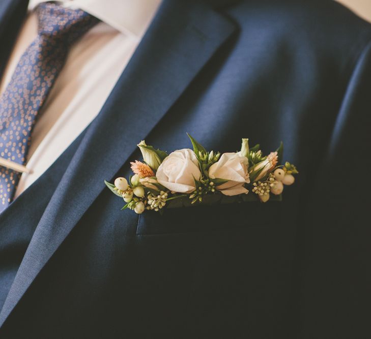 Floral buttonhole for groom at Bassmead Manor Barns