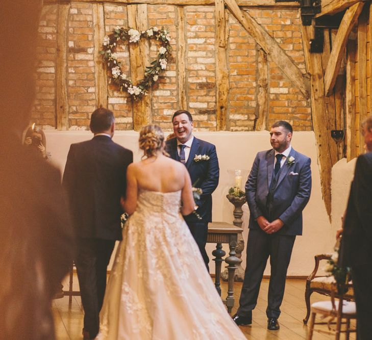 Groom sees bride walking down aisle