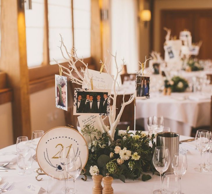 Photo tree centrepieces on wedding table