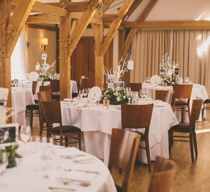 Wedding table with photo tree centrepieces