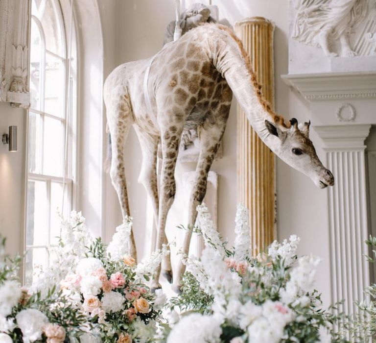 Hanging giraffe at Aynhoe Park wedding venue