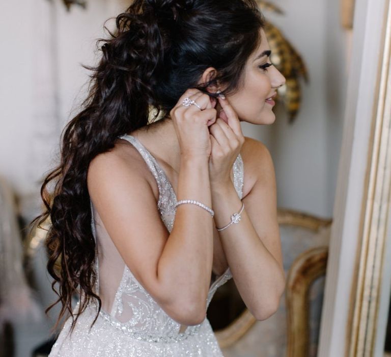 Bride in Berta Bridal gown getting ready on the wedding morning