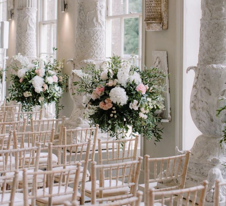 Aisle wedding flowers at Aynhoe Park wedding ceremony