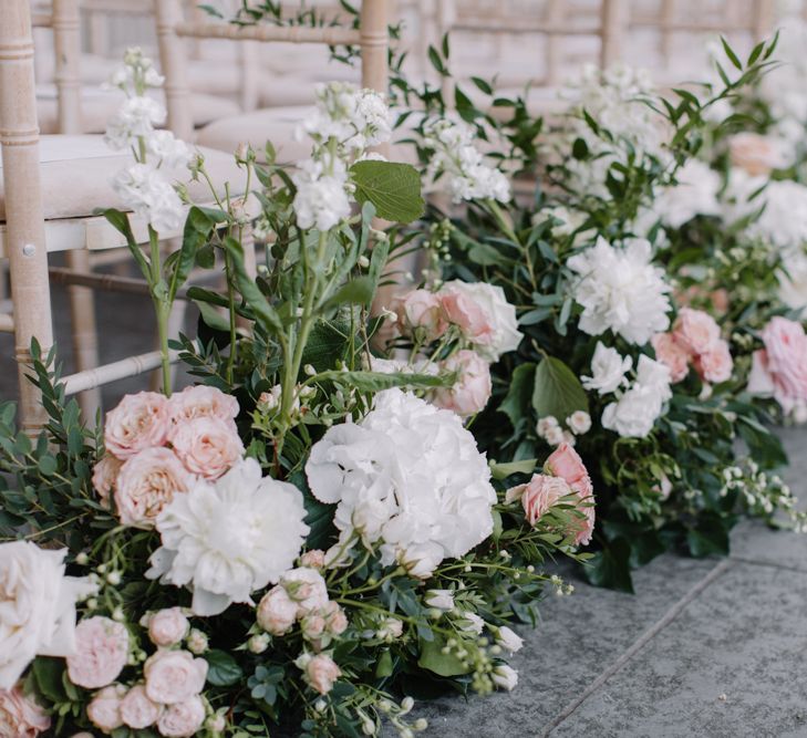 Pink and white aisle wedding flowers for Aynhoe Park ceremony