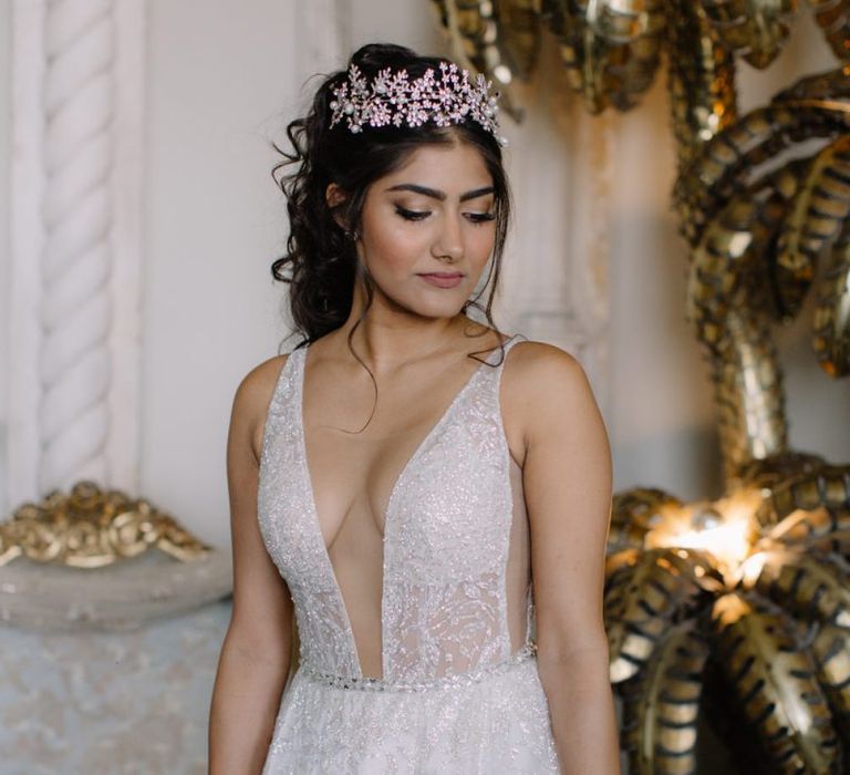 Bride in Berta Bridal gown with plunging neckline and crown