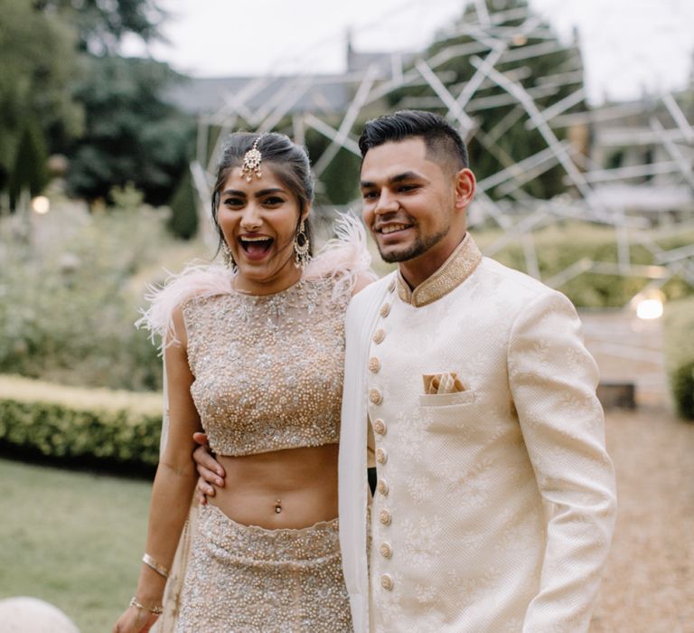 Bride and groom in traditional Indian wedding attire