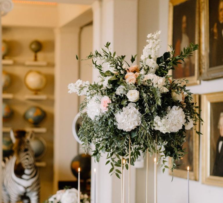 Tall wedding reception floral centrepiece