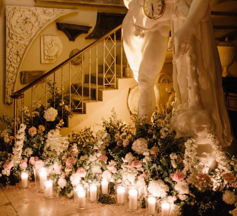 Romantic candle light decorating Aynhoe Park wedding