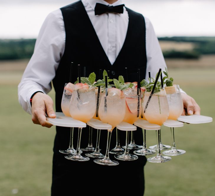 Wedding cocktails for luxury wedding at Aynhoe Park with Berta Bridal gown